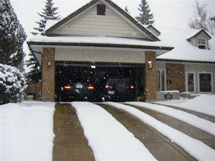 Heated driveway with two 24-inch wide heated tire tracks.